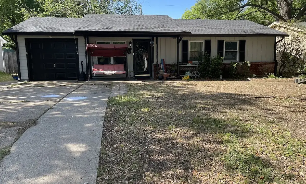 Asphalt Shingle Roof Repair crew at work on a residential roof in Fayetteville